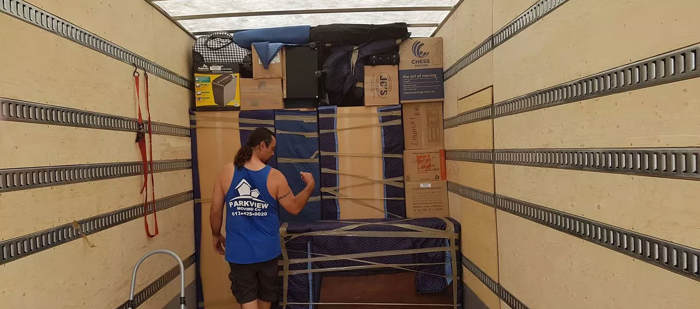 A mover packing a moving truck perfectly.