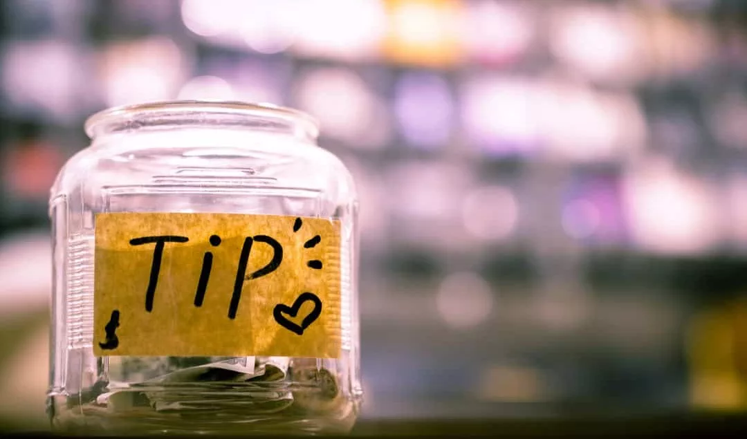 A glass jar labeled 'tip.