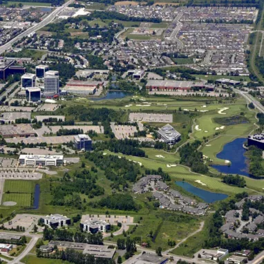 An aerial view of a city and a golf course.