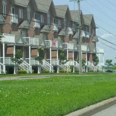 A row of apartment buildings on a street in Orleans.