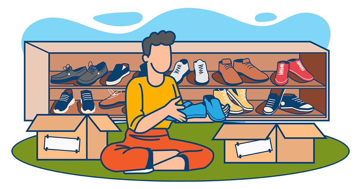 A person is sitting on the ground, holding shoes with multiple boxes and a shoe rack filled with various shoes behind them, contemplating how to pack shoes for moving.