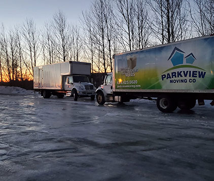 Parkview Moving Co.'s long-distance moving truck taking a pit stop to recharge, refuel, and ensure safety during the journey.