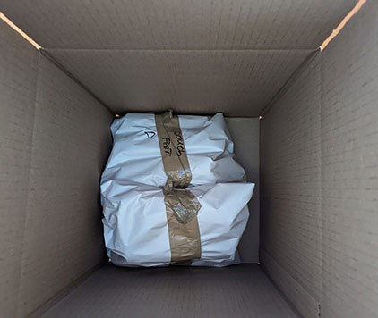 Sofa cushions carefully wrapped, protected, and packed into a moving box for a local Ottawa move by Parkview Moving Co.