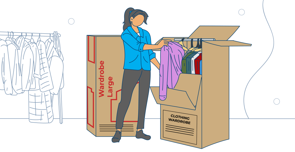 A woman unpacks clothes from a large wardrobe box, transferring them into a closet surrounded by hanging garments and moving boxes.
