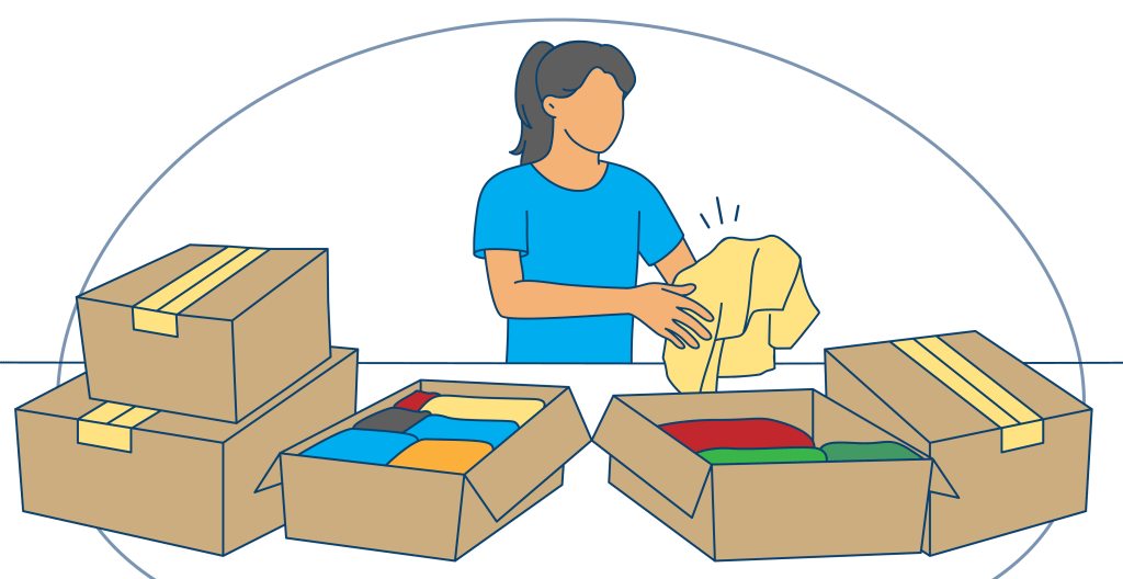 A woman carefully packs clothes into cardboard boxes, surrounded by several open and filled boxes, as she prepares for a move.
